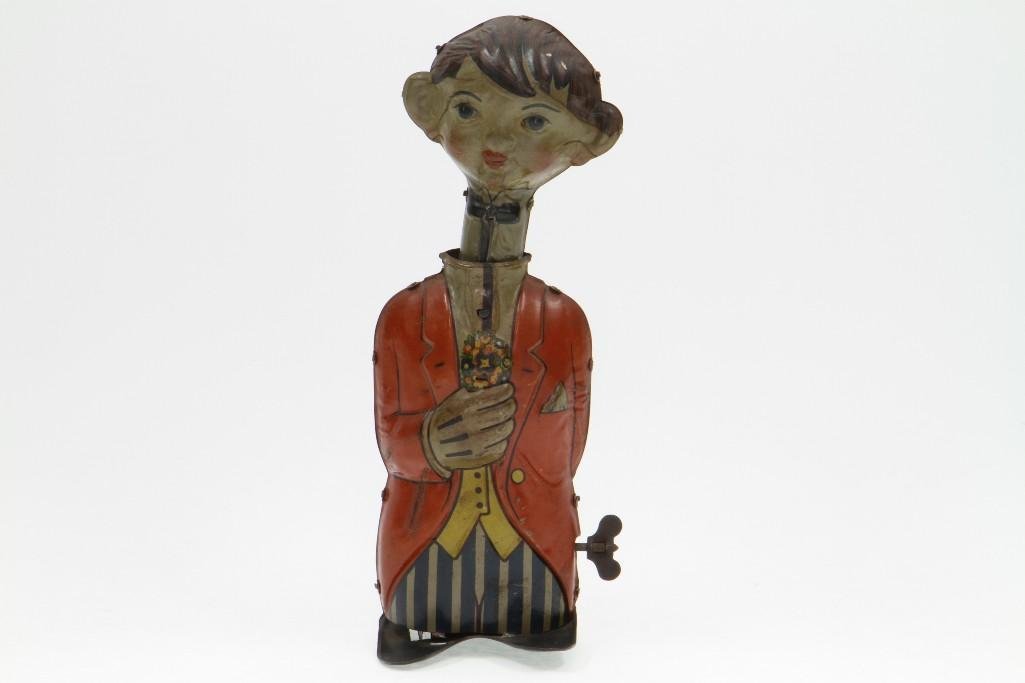 M 379 Cartoon Figure: Bing Tin Lithograph, Clockwork Activated Head Moves Vertically with Forward Motion; Excellent Condition, 9 3/8"H Notes:Turner Auctions + Appraisals is pleased to feature the Anita & Sedwick Hellm