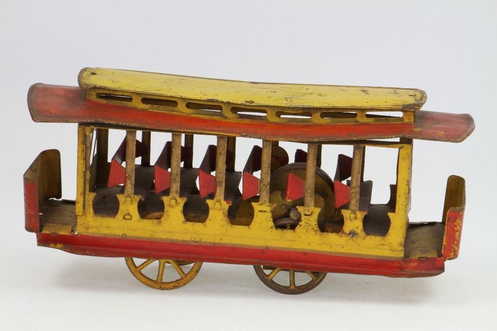 Summer Trolley: Dayton, Multi Colored Pressed Steel, Friction Driven, Bend in Roof, Missing (2) Figures; good Condition, 13 1/2"L Notes:Turner Auctions + Appraisals is pleased to feature the Anita & Sedwick Hell