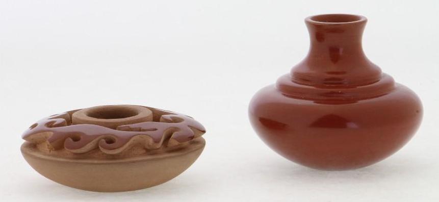 Two Santa Clara miniature jars: The carved example by Nancy Youngblood Cutler, 1980; the other signed Shirley Cactus Blossom Both approximately 2 inches wide Provenance: Turner Auctions + Appraisals is pleased to offer the library a