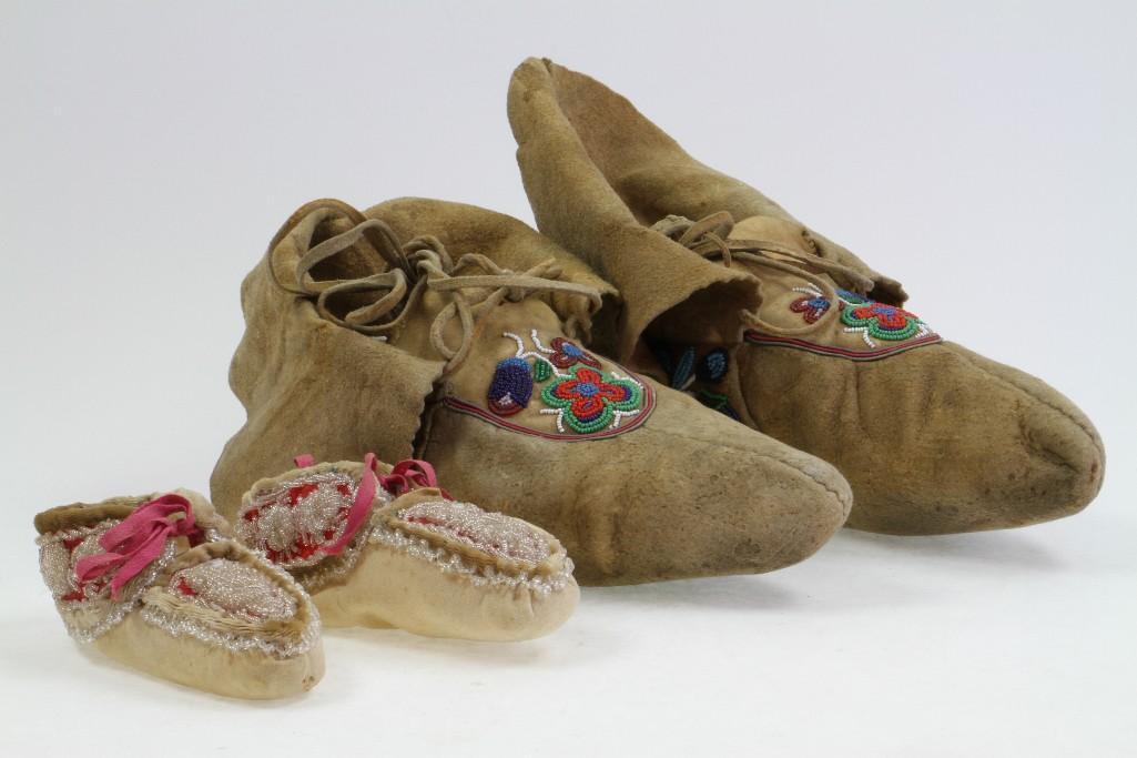 Two pairs of beaded moccasins: Including adult's size Cree examples, and a pair of Iroquois footwear for a young child Bottom: 10 inches Bottom: 5 inches Provenance: Turner Auctions + Appraisals is pleased to offer the library and 