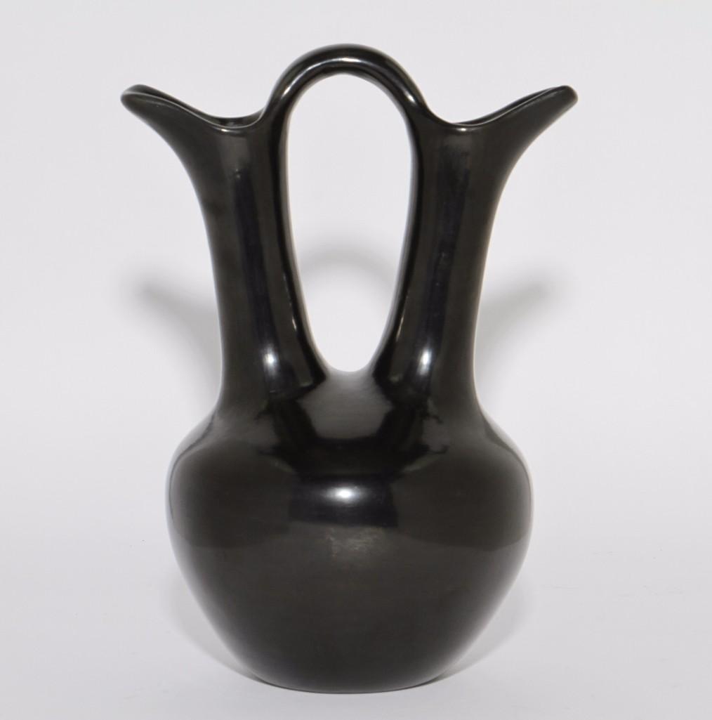 San Ildefonso blackware wedding vase: Rose Gonzales Height: 12 1/2 inches Provenance: Turner Auctions + Appraisals is pleased to offer the library and selected artifacts from the personal collection of Jim Haas, the noted, long-time speci