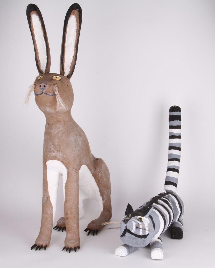 Two New Mexican folk art carvings: Including a jackrabbit by Felipe Benito Archuleta; and a cat (unsigned) Rabbit height: 33 inches Cat length: 20 inches Provenance: Turner Auctions + Appraisals is pleased to offer the library and sele