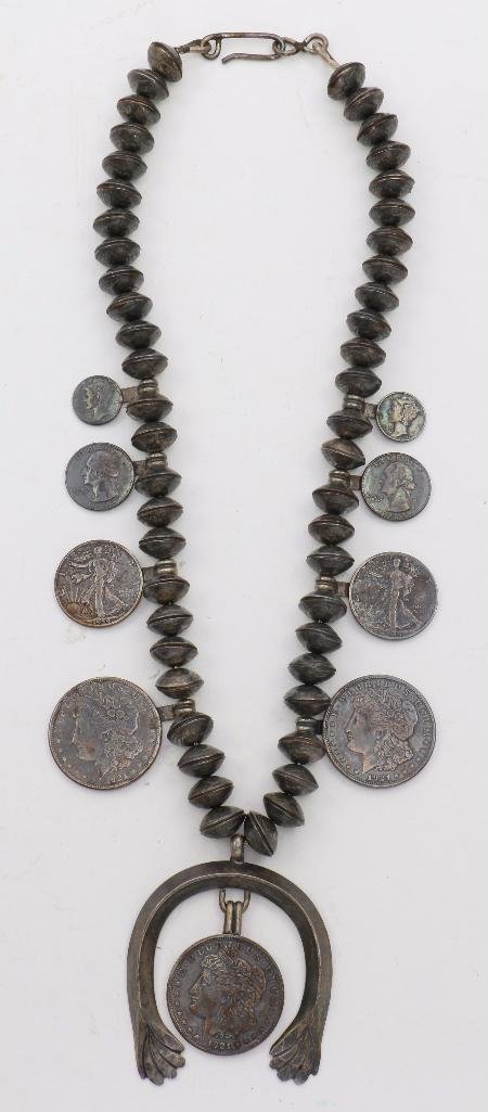 SOUTHWEST COIN SQUASH BLOSSOM NECKLACE: Vintage 70s Southwest jewelry, a coin squash blossom necklace made with dime beads and other coins approximately 15 inches long. approximate total weight: 436 g Notes:Turner Auctions + Appraisals is p