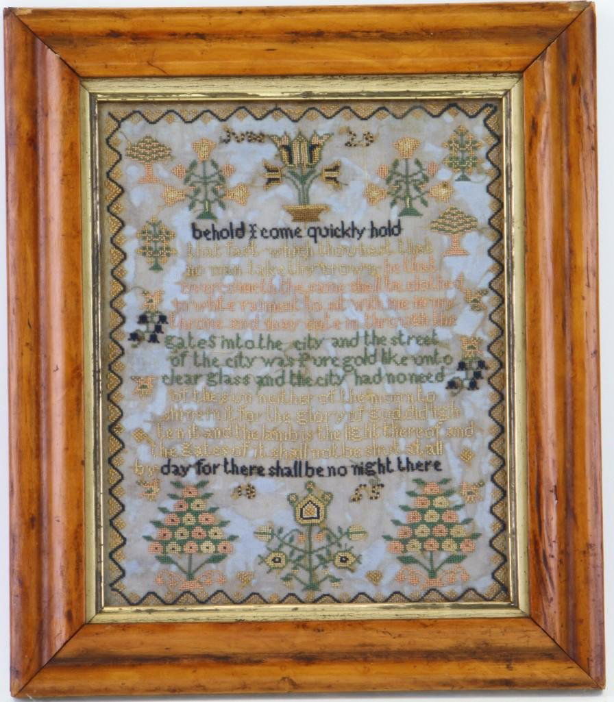 A silk and linen Needlework sampler 19th century: A first-quarter 19th century silk and linen needlework sampler, Possibly American Centering a verse surrounded by stylized floral basket and trees, all with in a meandering garland border 9.5&qu
