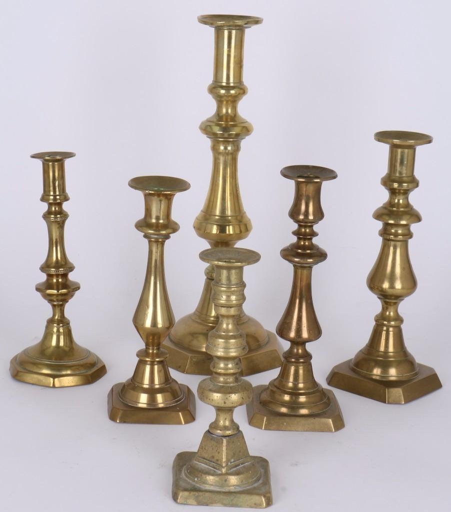 SIX VARIOUS ENGLISH BRASS CANDLESTICKS: 19TH CENTURY, HEIGHTS BETWEEN 7 3/4 & 14 INCHES. Notes:This "Fine Mélange" comes from numerous sources and estates. Here are just some of items this sale includes: charming Steiff animals (over 4