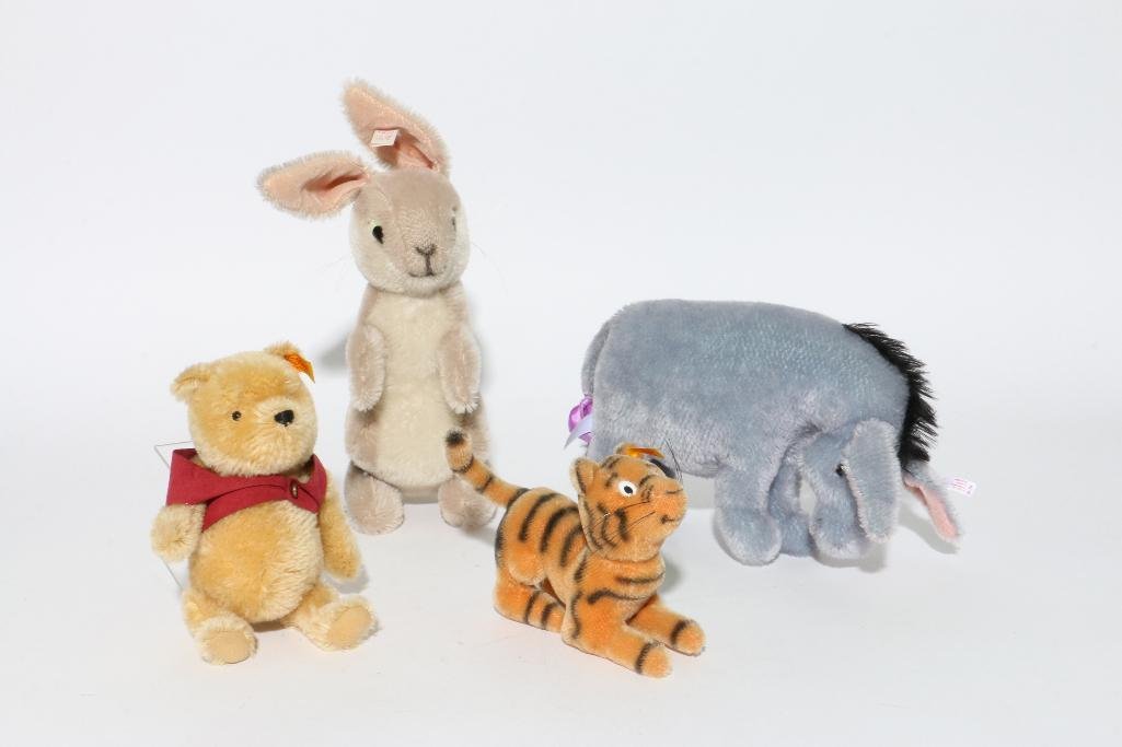 FOUR STEIFF POOH ANIMALS: Character Steiff, "Pooh", "Rabbit", "Tigger" and "Eeyore" Notes:This "Fine Mélange" comes from numerous sources and estates. Here are just some of items this sale includes: charming Steiff animals (o