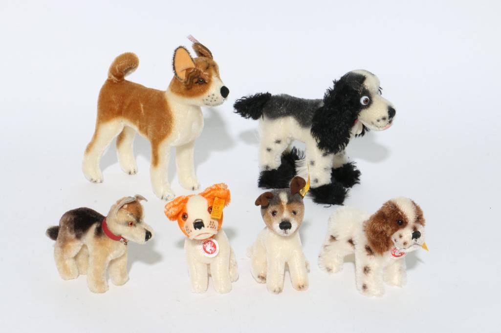 SIX STEIFF DOGS: Steiff dogs in various sizes Notes:This "Fine Mélange" comes from numerous sources and estates. Here are just some of items this sale includes: charming Steiff animals (over 40 lots of almost 150 ite
