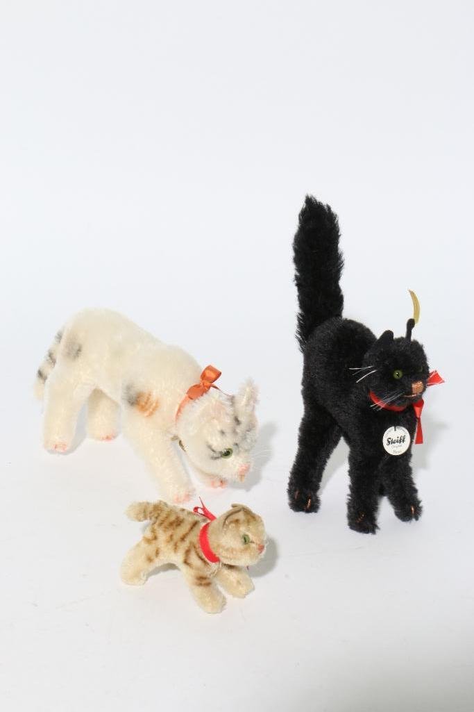 THREE STEIFF CATS: Three Steiff cats Notes:This "Fine Mélange" comes from numerous sources and estates. Here are just some of items this sale includes: charming Steiff animals (over 40 lots of almost 150 items), Louis 
