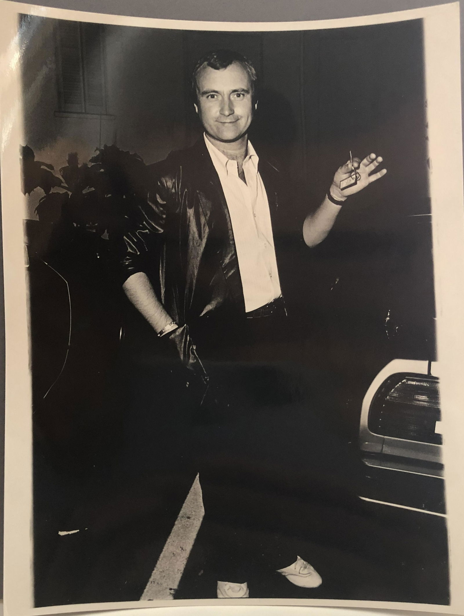 Phil Collins 1983 Original Photo - Photographer stamp: Phil Collins the lead singer of the rock group, Genesis now on concert tour with Robert Plant. About to leave for his hotel for a good night sleep after a stroll in Beverly Hills. Photo taken by Grani