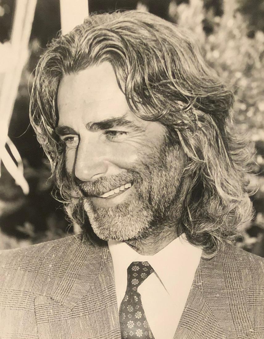 Sam Elliott 1988 Playboy Mansion - photographer stamp: Sam Elliott at Operation California Western Art Sale at the Playboy Mansion. Taken June 11, 1988 by noted photographer Scott Downie w/ photographer stamp and description verso. 9x7 on Kodak paper.