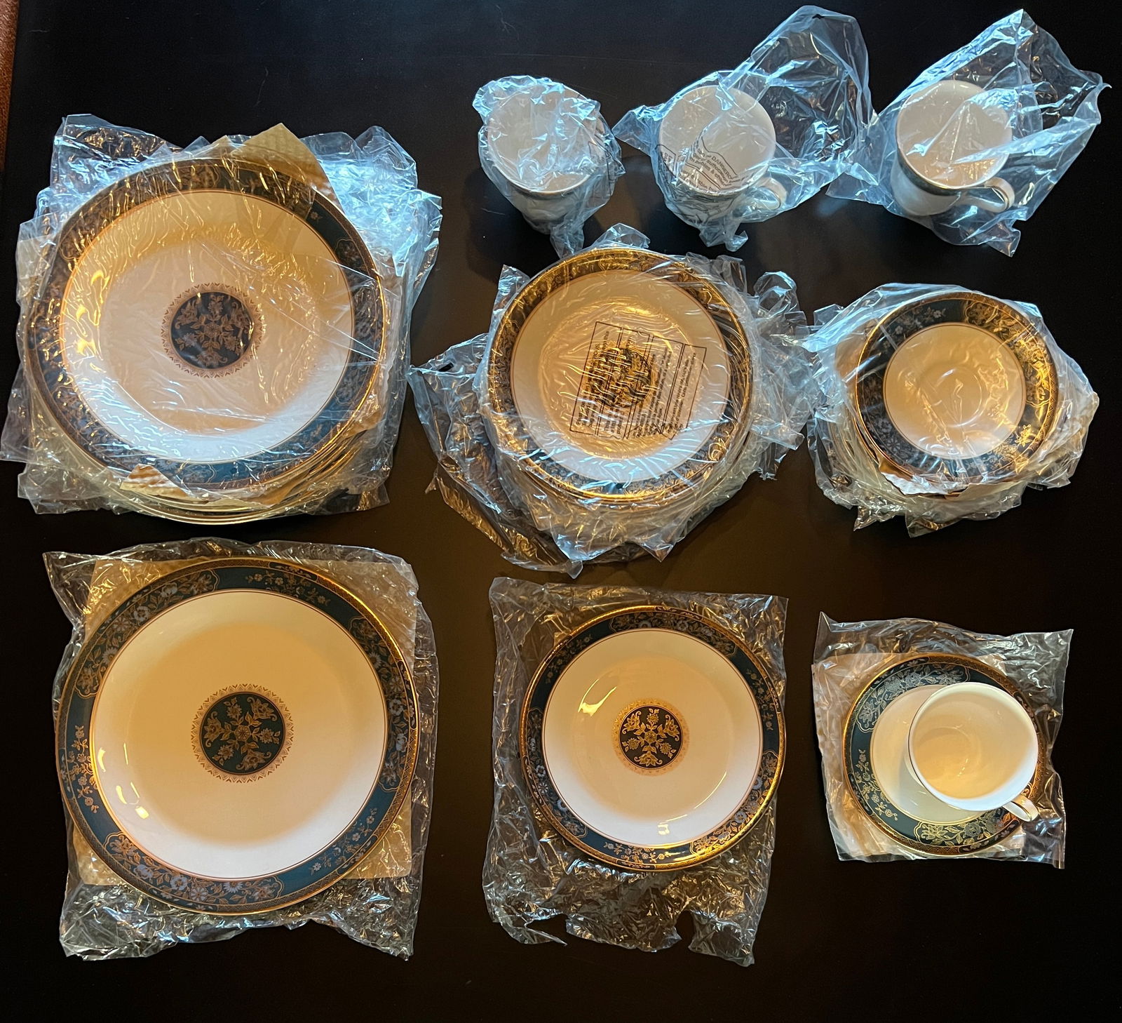 Royal Doulton Set of China-"Carlyle" 8 place set of 32 pcs- never used: Royal Doulton "Carlyle" 32 pc set for 8. English Fine Bone China . Carlyle : H.5018 This was first produced in 1972 and discontinued in 2001. Never Used. Blue Flower Gold Leaves Rich Teal Band. Dinner