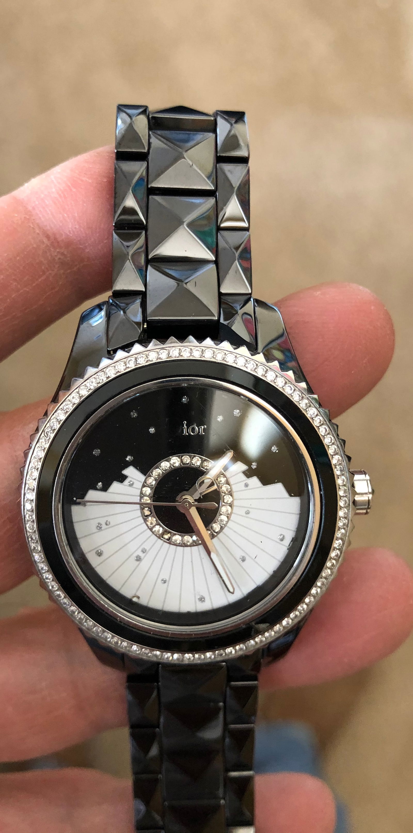 Dior V111 Ladies Watch 114 diamonds: Dior V111 Ladies Watch - Mother of Pearl and Black Ceramic. Stamped: Dior V111 Water Resistant 50M Swiss Made V111 place Vendome. FL7788 Model CD124EO Dior is etched on the clasp. 