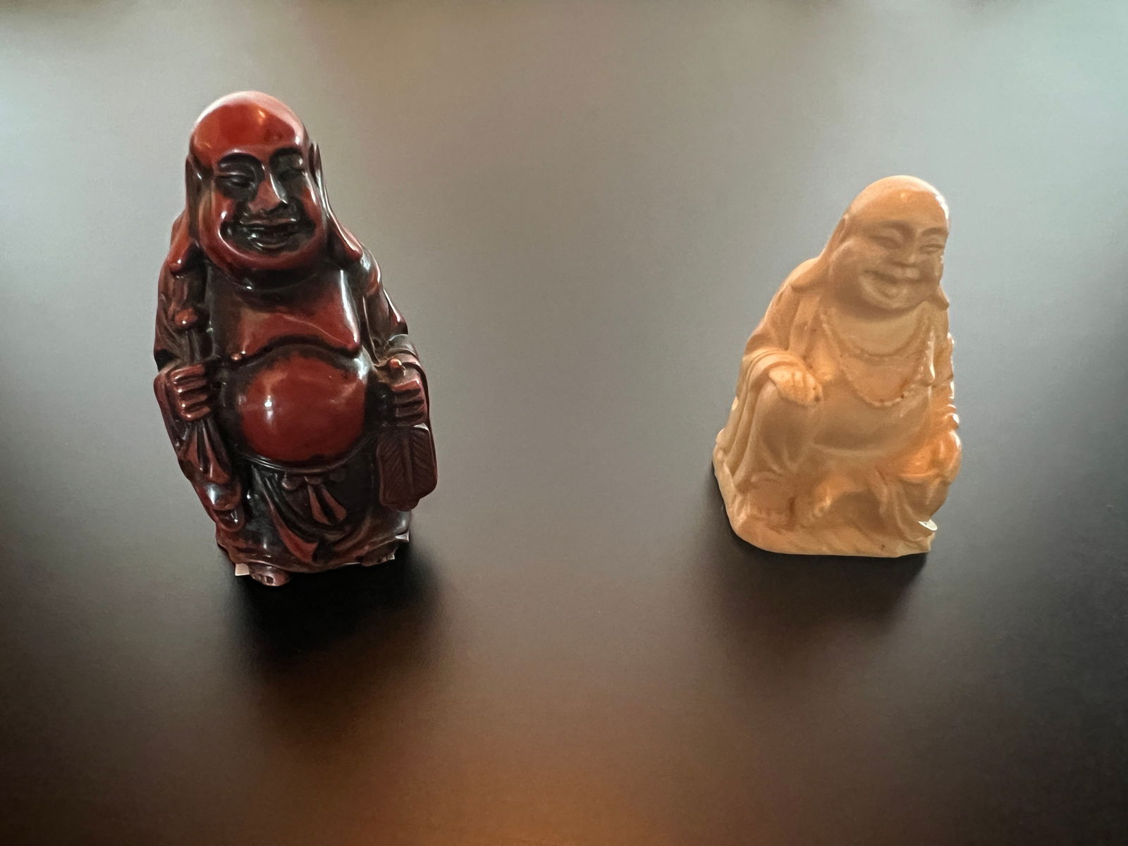 Pair of Budha: Pair of Budha (not sure of material- maybe bone or wood) A) 2 1/2 x 1 1/4 x 1 base B)ivory color : 2 x 1 1/4 x 1 1/8 base