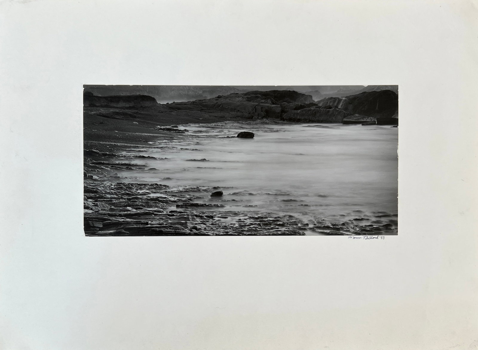 Wynn Bullock (1902-1975) Silver Gelatin Signed 1958 " Weston Beach": Wynn Bullock (1902-1975) - Silver Gelatin. Signed Lower right. Dated 1958. " Weston Beach". Multiple stamps verso, #1358F ref no in pencil. Photo: 4.5 x 9.25". Mat: : 10.5 x 14.25 Vintage 1958 w