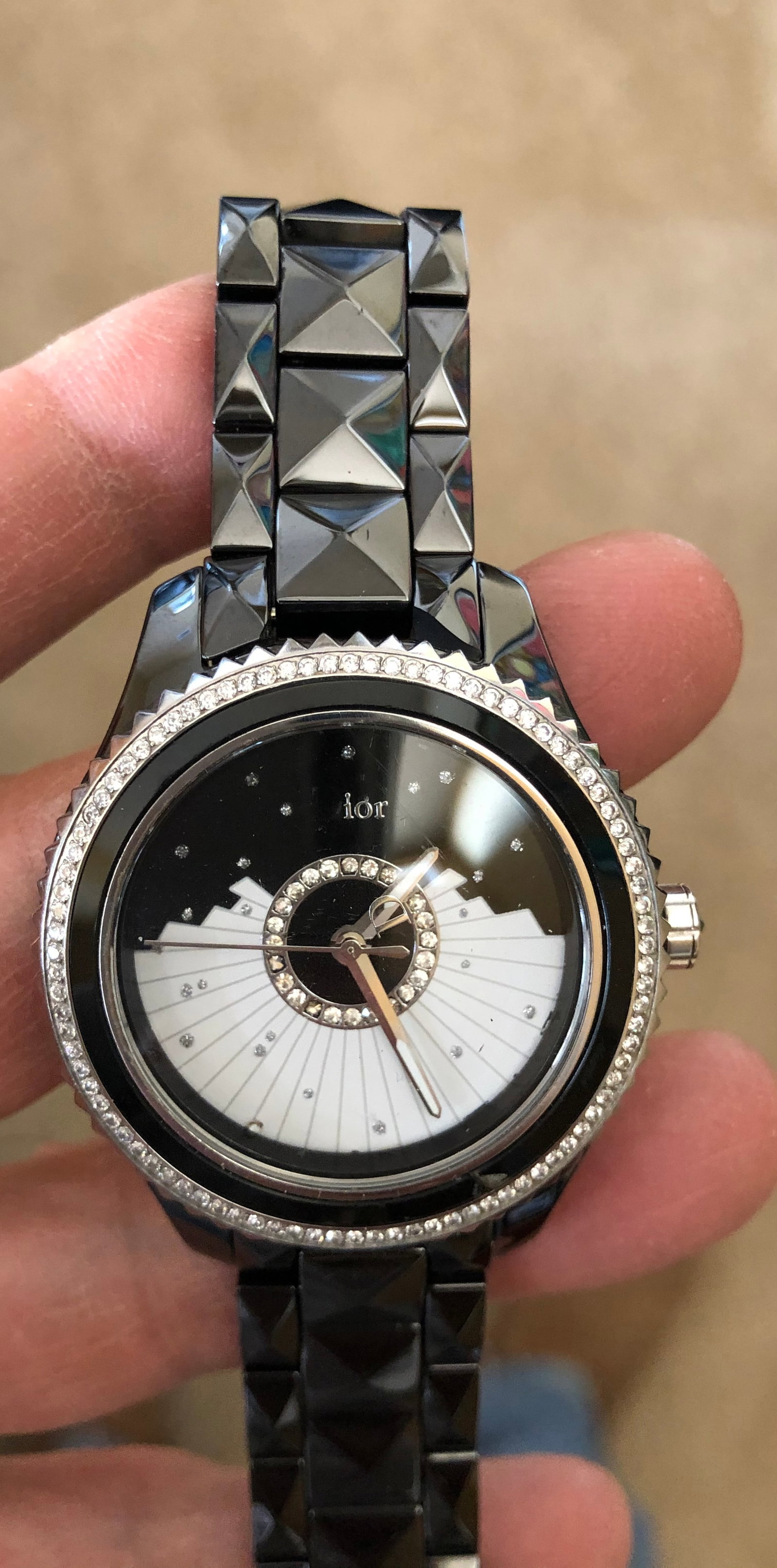 Dior V111 Ladies Watch 114 diamonds: Dior V111 Ladies Watch - Mother of Pearl and Black Ceramic. Stamped: Dior V111 Water Resistant 50M Swiss Made V111 place Vendome. FL7788 Model CD124EO Dior is etched on the clasp. The round dial