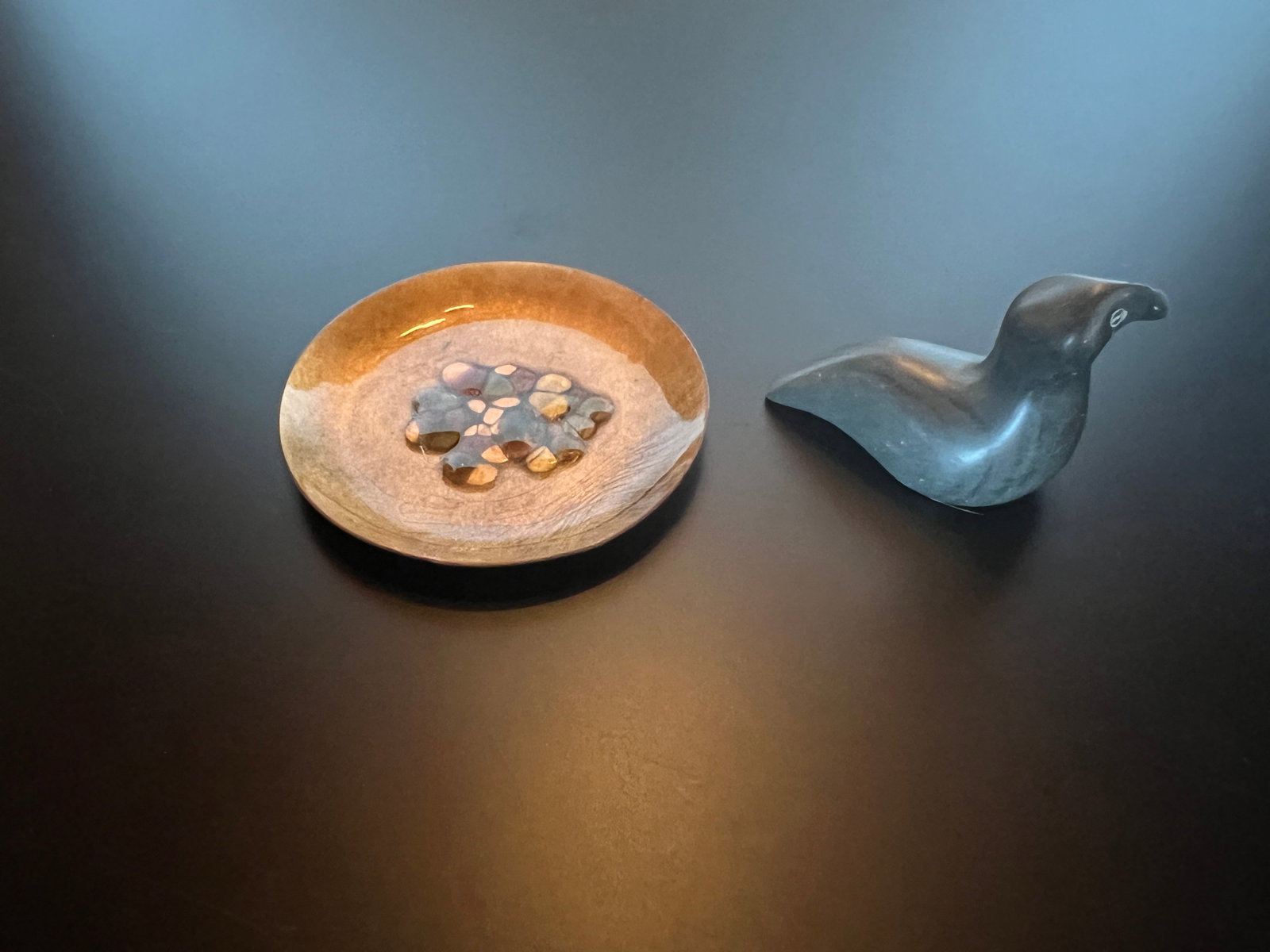 Painted Ceramic Plate and Carved Stone: Mix lot : A) Carved Stone of a Seal - signed on base " Caroline" " E9-104" BI. Has chip at edge tail maybe natural. Dim: 2 1/4 x 2 1/2 x 1 1/4. B) Glazed artistic painted plate- maybe a type of