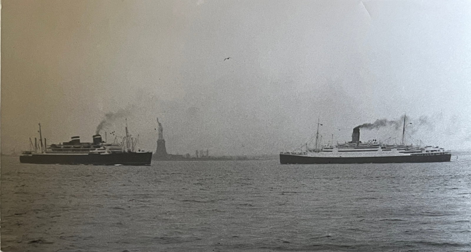 Marguerite Baker Johnson - Mid Century Photograph- Prominent Americana Photographer. Two ships and: Photographer : Marguerite Baker Johnson. Black and white Vintage Mid Century Photograph. Dimensions: 5.25 x 9.25 Stamped Verso. Johnson was a native of Brussles Belgium and was a noted female photogra