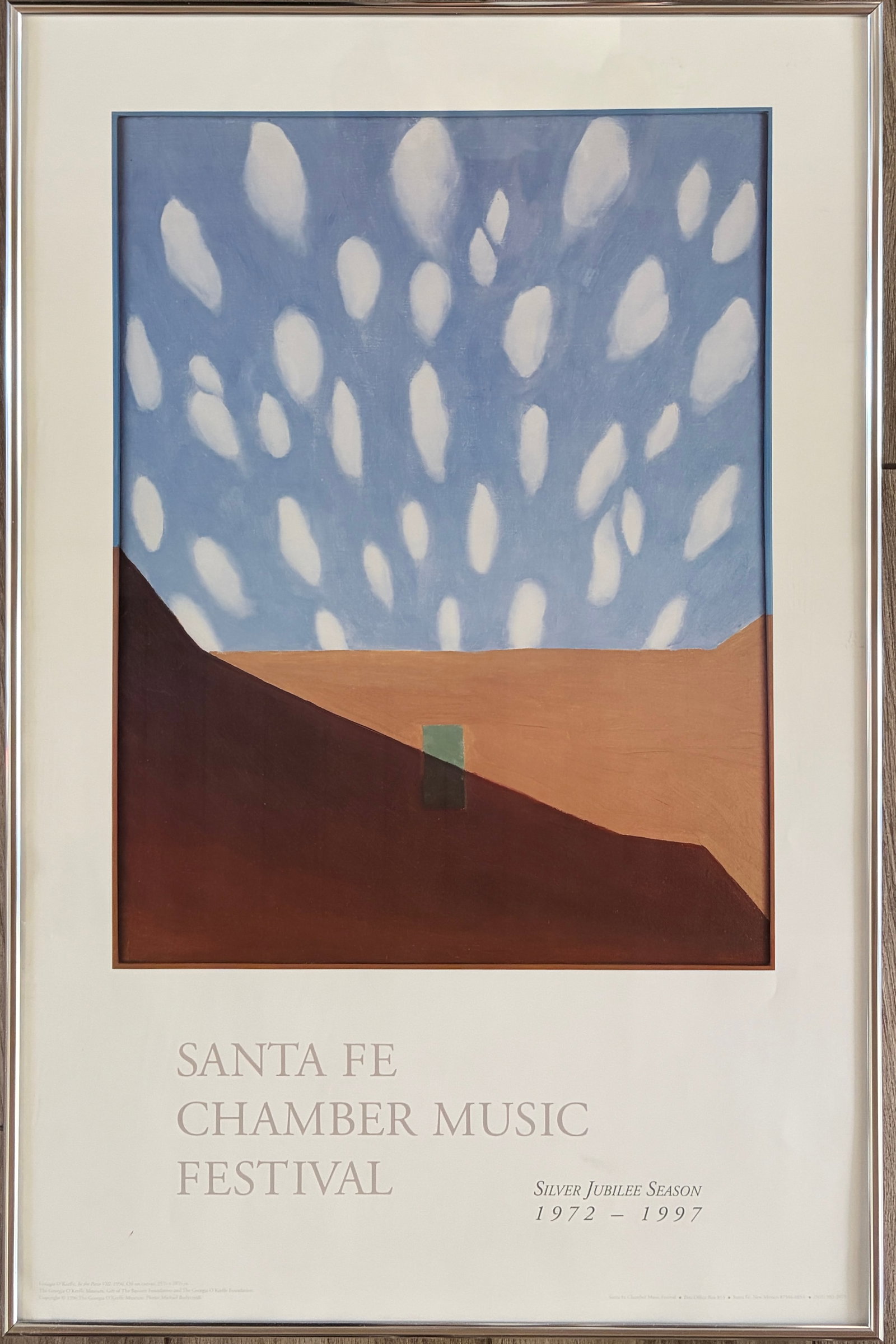 Santa Fe Chamber Music Festival Silver Jubilee Season 1972-1997 Exhibition Print- Georgia O'Keefe: Santa Fe Chamber Music Festival- Silver Jubilee Season 1972-1997. Image of Georgia O'Keefe "In the Patio V111" from 1950. Framed: 32 x 21"