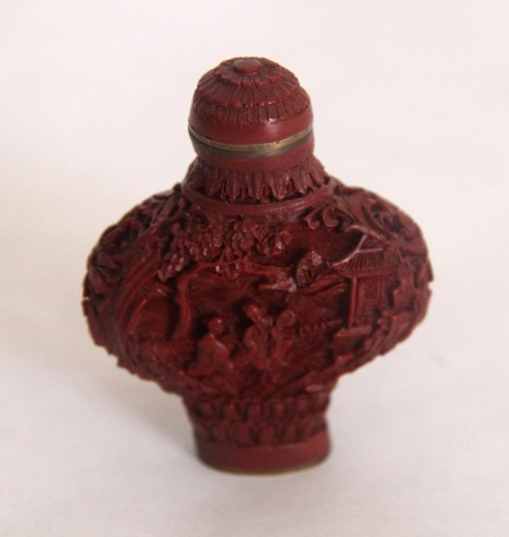 Chinese Cinnabar Snuff Bottle: Chinese Cinnabar Snuff Bottle with mark on the base. size:H 2 1/2' W 2' inch.