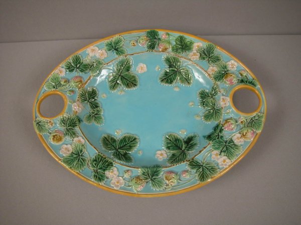 GEORGE JONES majolica strawberry platter with turq: GEORGE JONES majolica strawberry platter with turquoise ground and fitted holes for cream and sugar which are missing, 14 1/2", rim repair
