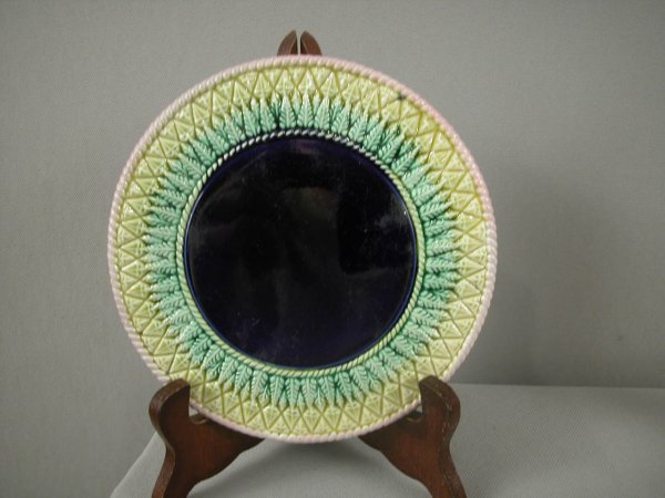 Pinepple majolica trivet with pink rope border and: Pinepple majolica trivet with pink rope border and cobalt center, 6 3/4"d, rare form