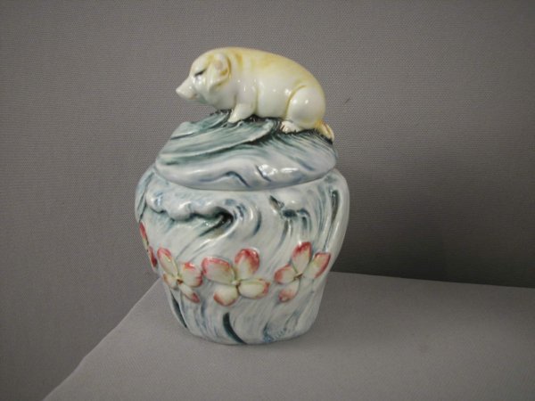 Majolica humidor with pig on cover of jar with flo: Majolica humidor with pig on cover of jar with floral motif , minor rim nick, 5 1/2"h