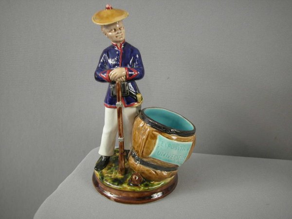 SARREGUEMINES rare figural match striker with Fren: SARREGUEMINES rare figural match striker with French soldier celebrating the Paris Exhibition, #2180, 8"