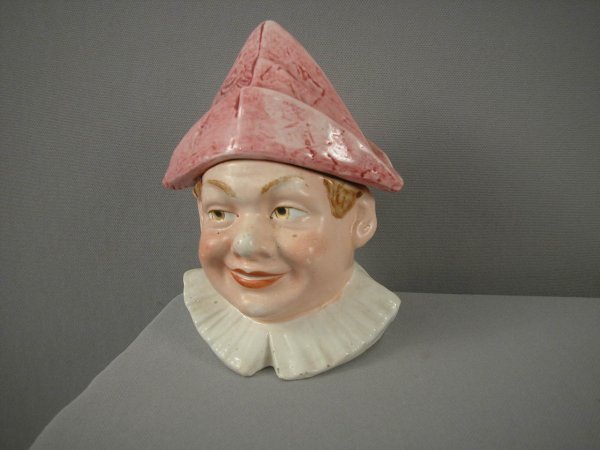 Majolica humidor in the form of a boy with a red t: Majolica humidor in the form of a boy with a red tri-corner hat, 6 3/4", hairline to base