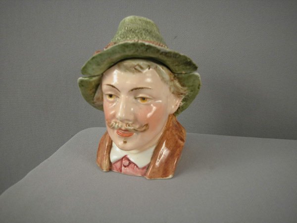 Majolica humidor in the form of a man with a green: Majolica humidor in the form of a man with a green hat and mustache, nick to hat rim, 5", ref: Horowitz p. 15 #004