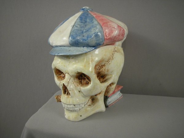 Majolica humidor of skull with red white and blue : Majolica humidor of skull with red white and blue hat on book, 8 1/2", nice