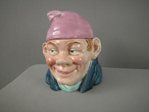 Majolica humidor of many with pink cap and blue co: Majolica humidor of many with pink cap and blue coat, 5 1/2"