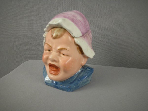 Majolica humidor of crying baby with bonnet, 5", h: Majolica humidor of crying baby with bonnet, 5", hairline to lid