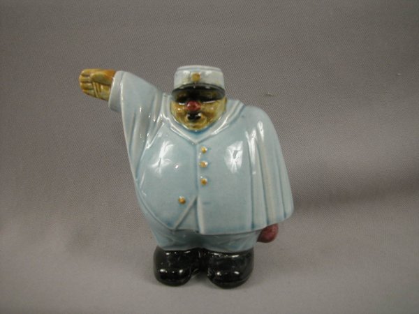 SARREGUEMINES figural ceramic bank in the form of : SARREGUEMINES figural ceramic bank in the form of a police man, professional repair to money slot, 5"
