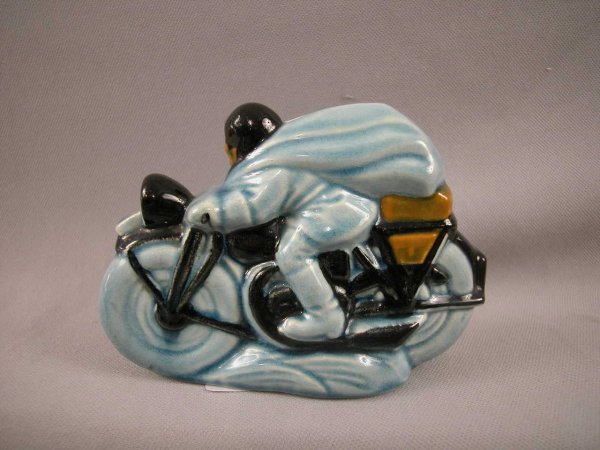 SARREGUEMINES figural ceramic bank in the form of : SARREGUEMINES figural ceramic bank in the form of a man riding a motorcycle, ref: Bottero p. 39, 4"h