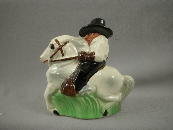 SARREGUEMINES figural ceramic bank in the form of : SARREGUEMINES figural ceramic bank in the form of a cowboy on horse, ref: Bottero p. 35, 5", minor chip to money slot