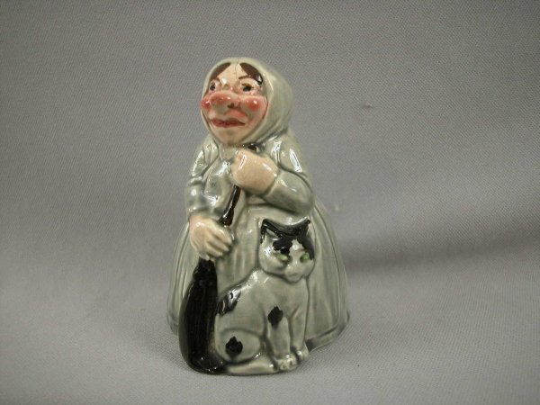 SARREGUEMINES figural ceramic bank in the form of : SARREGUEMINES figural ceramic bank in the form of a lady with cat and broom, hairline , ref: Bottero p. 37