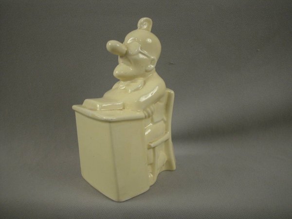 SARREGUEMINES figural ceramic bank in the form of : SARREGUEMINES figural ceramic bank in the form of a man seated at desk, 5 1/2", ref: Bottero p. 36