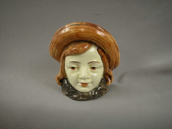 Majolica still bank in the form of a girl with lar: Majolica still bank in the form of a girl with large hat