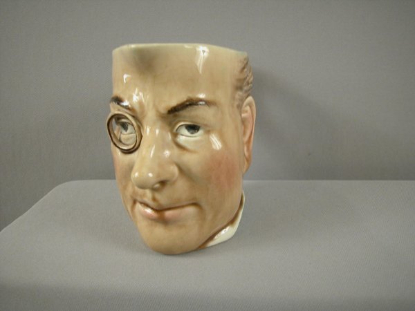 SARREGUEMINES figural face jug #3466, "Chamberlain: SARREGUEMINES figural face jug #3466, "Chamberlain", ref: Cunningham p. 75, very rare form, professional repair to eye glass, 5 3/4"