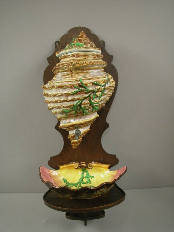 SARREGUEMINES rare form fountain or lavabo, 3 piec: SARREGUEMINES rare form fountain or lavabo, 3 pieces, large shell with cover and shell bowl mounted on wooden plaque, minor hairline to shell, extremely rare, great detail, 15"w, 24"h