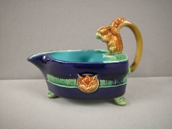 MINTON majolica extremely rare form creamer which : MINTON majolica extremely rare form creamer which matches Minton flat iron teapot, creamer has squirrel with nut on handle and fox heads on the sides, cobalt ground, outstanding color and detail, an e