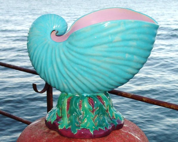 MINTON monumental majolica jardiniere in the form : MINTON monumental majolica jardiniere in the form of a large turquoise conch shell atop seaweed, rare form, 18 1/2"h, 21"w, professional rim repair