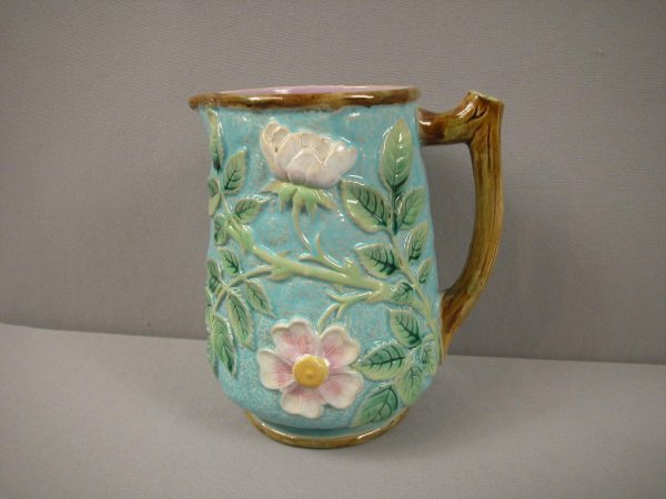 GEORGE JONES majolica wild rose rustic pitcher wit: GEORGE JONES majolica wild rose rustic pitcher with branch handle, great color, turquoise ground, 7", base chip