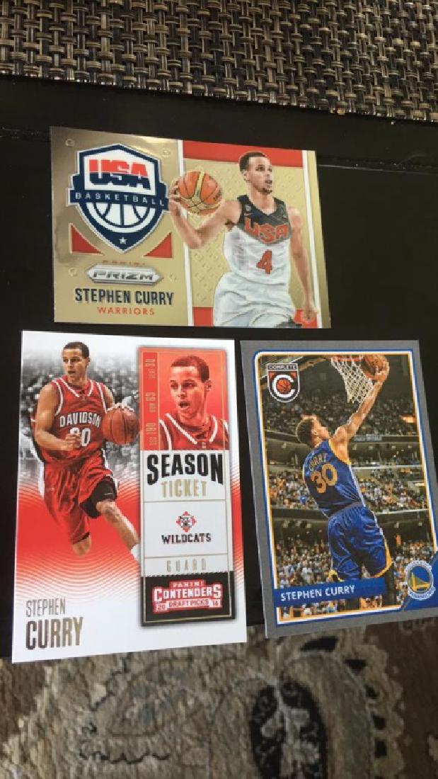 Stephen Curry three card but with a prism USA: basketball court really nice card Panini complete basketball Panini contenders season-ticket really nice lot