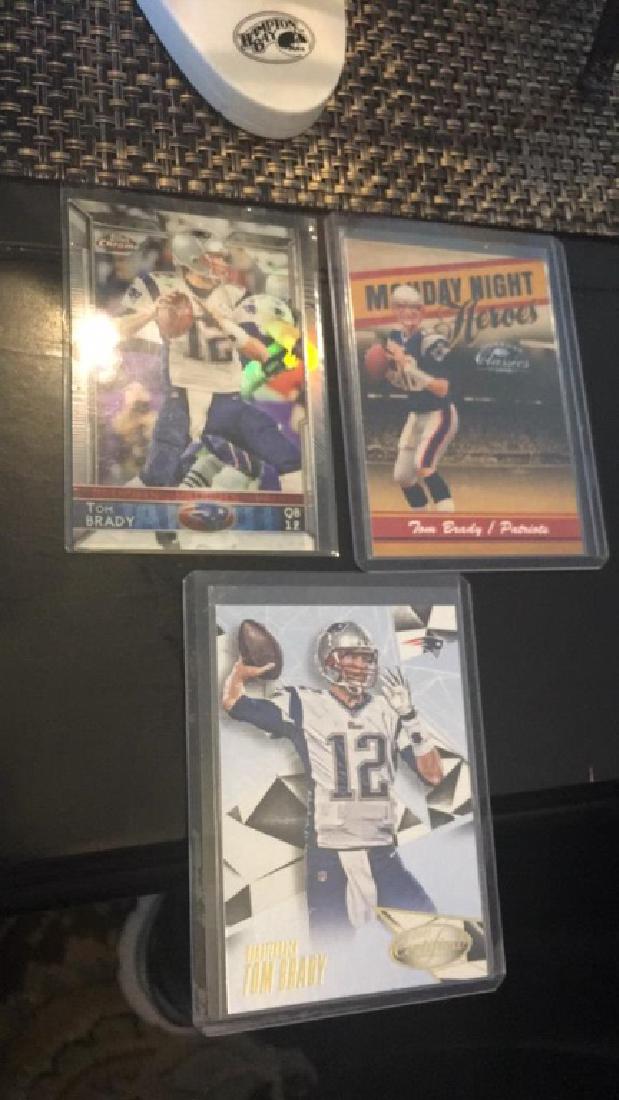 Tom Brady three card lot with a numbered insert (1 of 3)