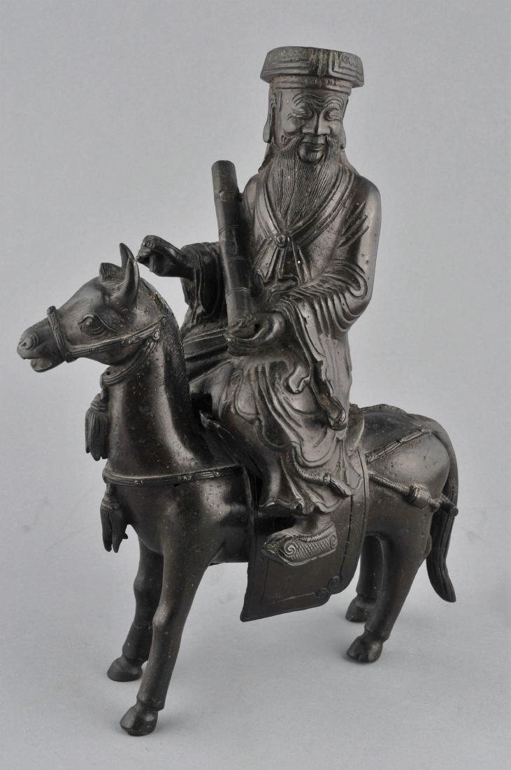 Bronze censer. China. 19th century. Cast in the form of: Bronze censer. China. 19th century. Cast in the form of an immortal riding a mule. 9" l. x 11-3/4" h. For additional and high-resolution images, please copy and paste the following link: https://www.d