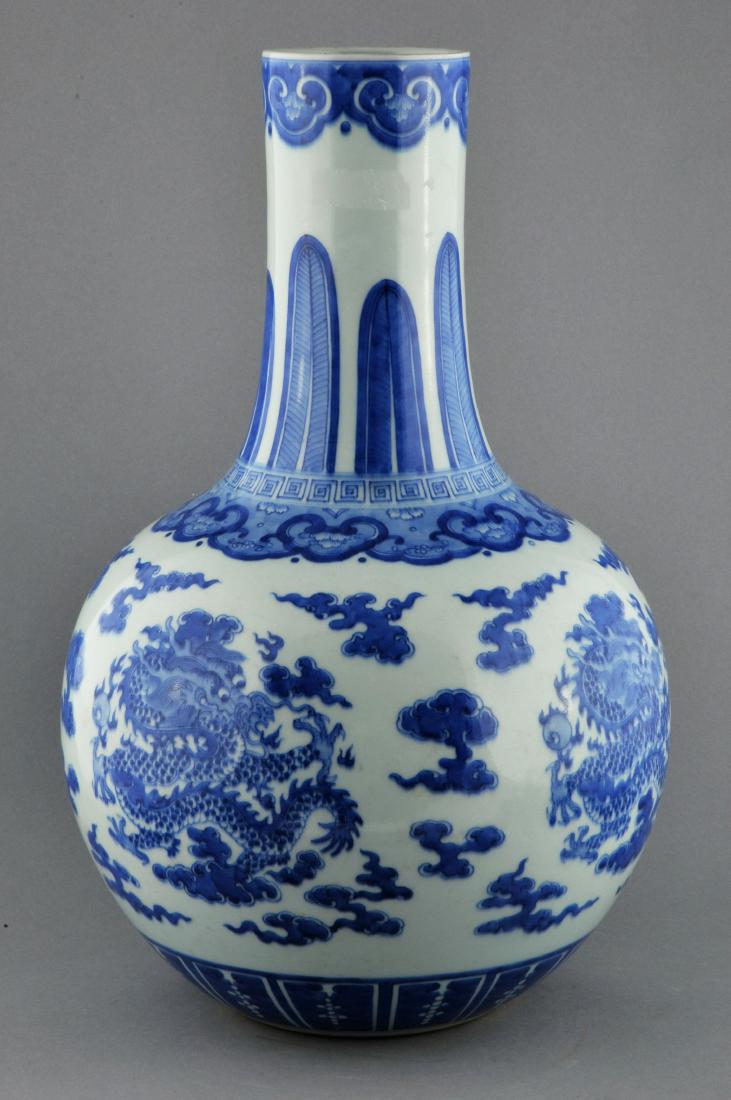 Porcelain vase. China. Kuang Hsu mark and possibly of: Porcelain vase. China. Kuang Hsu mark and possibly of the period. Underglaze blue decoration of dragons, pearls and clouds. 17" high. For additional and high-resolution images, please copy and paste t