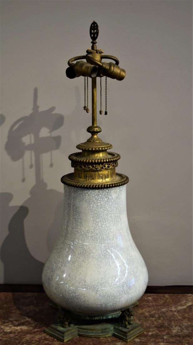 Porcelain vase. China. 19th century. White glaze with a (1 of 3)