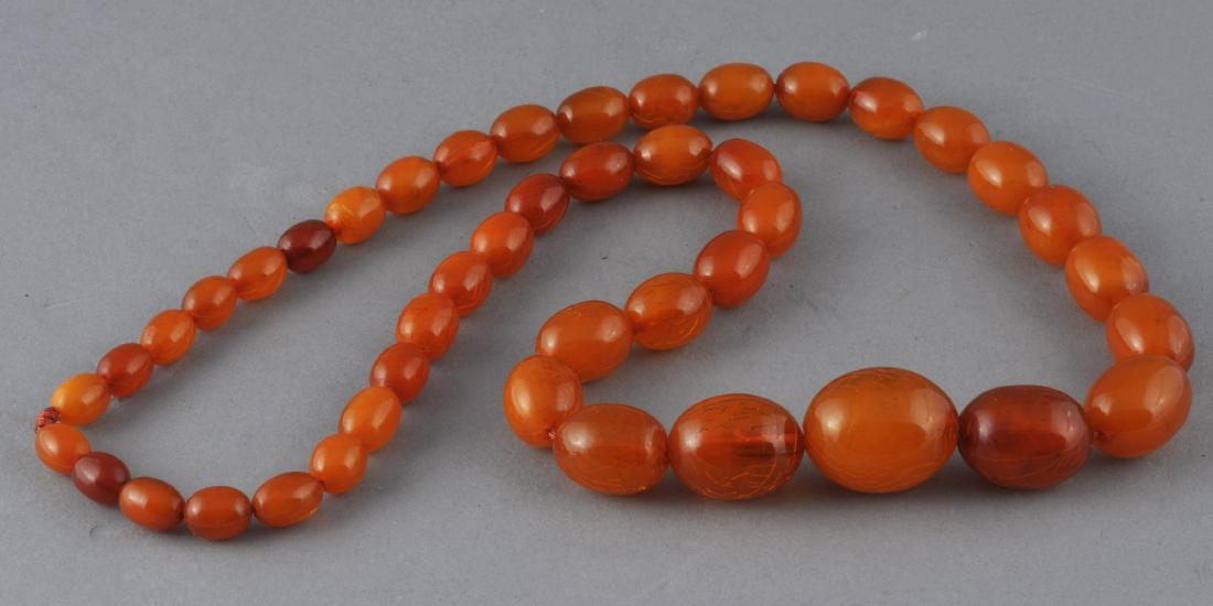 Set of graduated amber beads. Honey colored. (1 of 7)