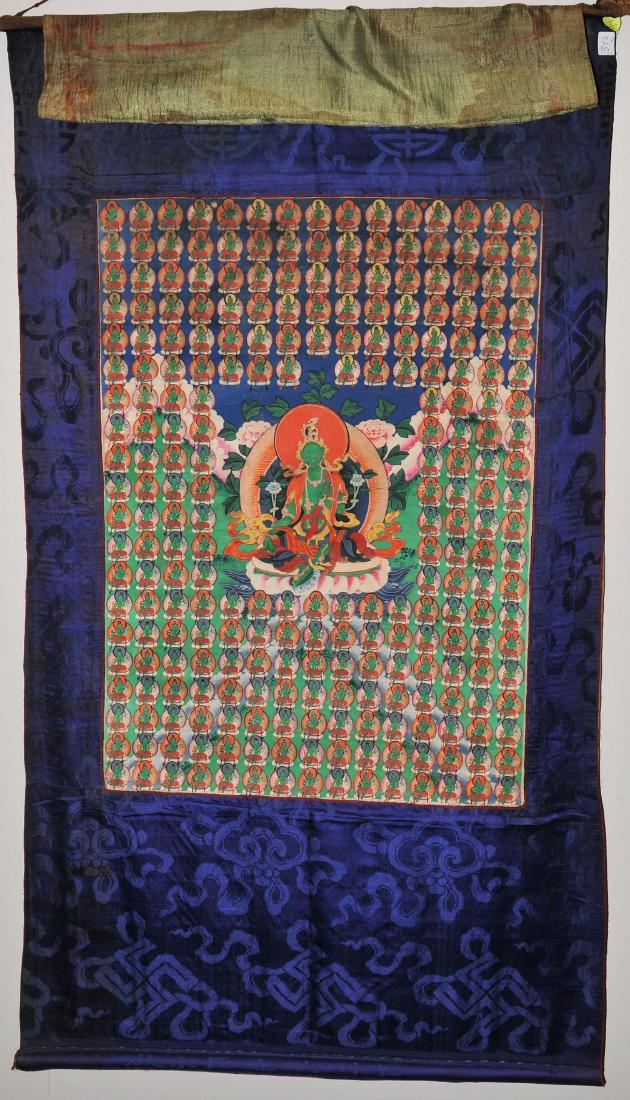 Buddhist Icon. Tibet. First half of the 20th century.: Buddhist Icon. Tibet. First half of the 20th century. Distemper on heavy cloth. Image of The Green Tara with her various manifestations. 24" x 17-1/2". Brocade mounts. For additional and high-resoluti
